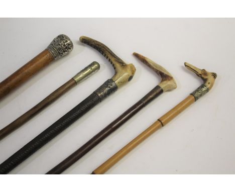 RIDING CROPS &amp; MILITARY PERISCOPE including one with the handle in the form of a dog's head and bamboo shaft, a Swaine &a