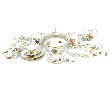 A Royal Worcester part dinner service, decorated in the Evesham pattern, including two coffee pots, each 19 by 10 by 20cm hig