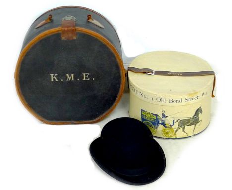 A Scott's Ltd black bowler hat, the white leather headband with gold embossed initials 'J F W' and the maker's logo, in origi