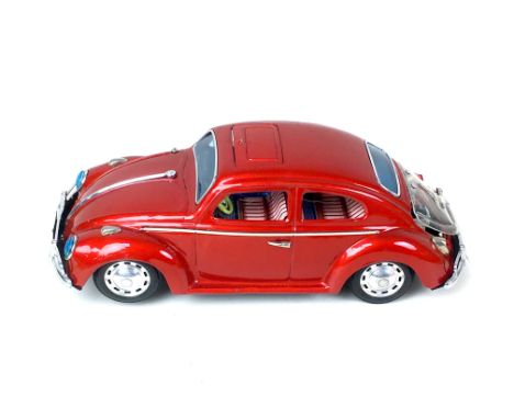 A Bandal battery operated Kingsize Volkswagen Sedan in red, with original box, together with a&nbsp;collection of vintage toy