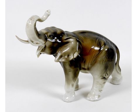 A large Royal Dux figurine, modelled as an elephant, standing with upraised trunk, impressed model number 378, raised triangu