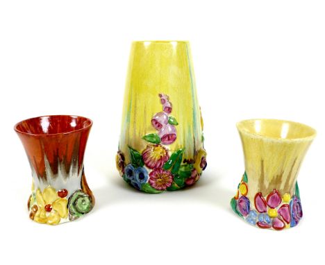 A pair of Clarice Cliff vases in the My Garden pattern, of squat flared form, with moulded flowers below, black backstamp to 