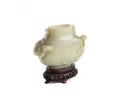 A CHINESE JADE FLASK, 18TH CENTURY of flattened form, the short neck with openwork scroll handles, the body carved with a chi