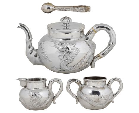 ˜A BOXED CHINESE SILVER THREE-PIECE TEA SET AND SUGAR TONGS, ARTISAN MARK OF HENG LAI, RETAILER'S MARK OF WA CHUN, HONG KONG,