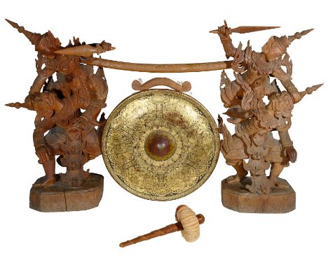 AN ANGLO-BURMESE DINNER GONG, CIRCA 1900 gilded and lacquered iron with black painted figural decoration, the supports of car