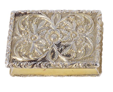 A GEORGE IV SILVER-GILT VINAIGRETTE, NATHANIEL MILLS, BIRMINGHAM, 1828 rectangular with canted sides, the lid richly chased w