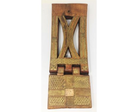 TWO FOLDING WOOD BOOK CRADLES, ETHIOPIA, 20TH CENTURY each carved with weave designs, one with gilding, the other with painte