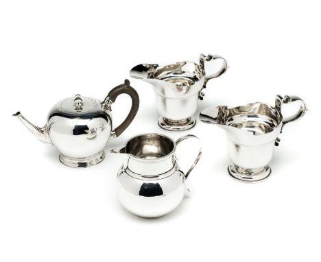 A PAIR OF GEORGE V SILVER MILK JUGS, GOLDSMITHS &amp; SILVERSMITHS CO. LTD., LONDON, 1930 in George II style, with shaped rim