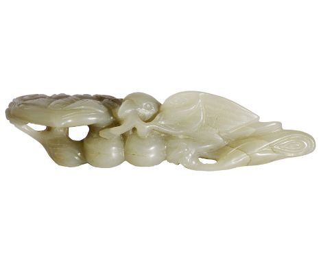 A CHINESE CELADON JADE BIRD AND LINGZHI GROUP carved and pierced in high relief with a bird perched on a ~lingzhi~ spray hold