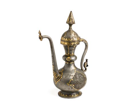 A QAJAR GOLD DAMASCENED IRON EWER, PERSIA, 19TH CENTURY of bulbous form with elaborately scrolling handle and slender spout, 