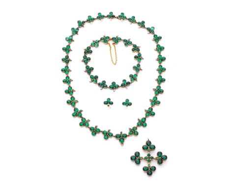 GOLD AND GREEN PASTE PARURE, EARLY 19TH CENTURY, COMPOSITE the necklace of shamrock links set with collet-set pear-shaped and