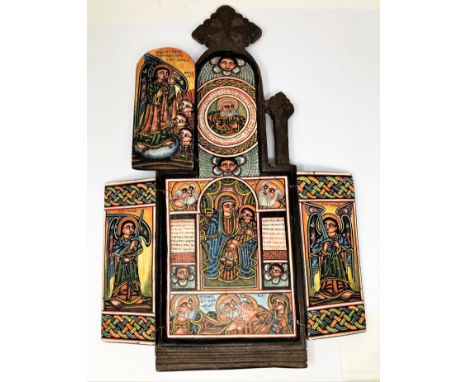 A PORTABLE ICONASTASIS, ETHIOPIA, 20TH CENTURY wood, carved and painted, of arched form, the exterior carved with cross motif