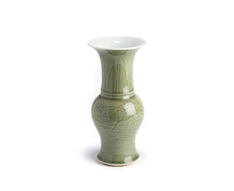 A CHINESE CELADON GLAZED VASE, KANGXI PERIOD (1662-1722) baluster, with lotus scroll below stiff leaves 23.5cm high  Provenan