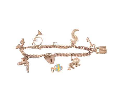 A 9 carat gold charm bracelet with charms attached, and a loose charm, a 4.3mm wide curb link 9 carat gold bracelet, fitted w