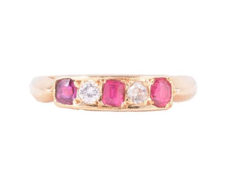 A ruby and diamond five stone ring, the oval, cushion and emerald cut rubies divided by an old cut diamond and a brilliant cu