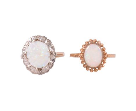 Two opal dress rings, an opal and diamond dress ring, the oval cabochon cut opal, approximately 11x9mm, surrounded by eight 8