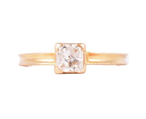 A diamond solitaire ring, the princess cut stone, 5.15x3.35mm, claw set in an 18 carat yellow gold mount ring size O, grooved