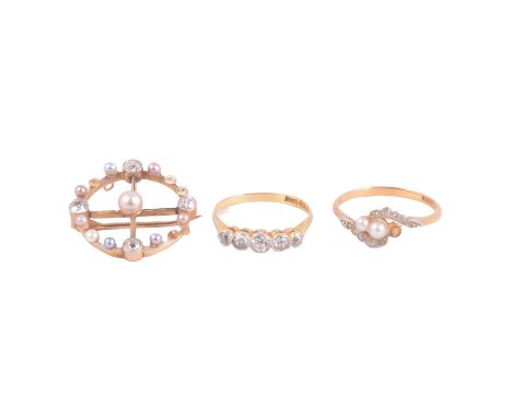 Two rings and a brooch, a diamond five stone ring, the old cut stones graduating in size millgrain set in a yellow and white 