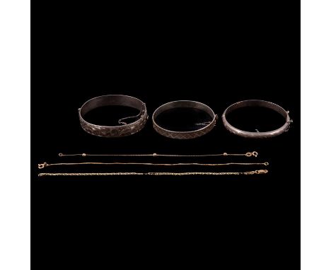 Three gold bracelets, and three silver bangles, two fine 9 carat yellow gold bracelets, flat S link and a bead and a box link