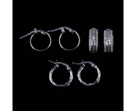 A pair of platinum hoop earrings, and two pairs of 9 carat white gold earrings, one diamond set, a pair of platinum twisted h