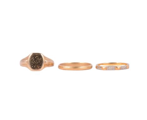 Two wedding bands and a signet ring, a yellow metal wedding band, 2.65mm wide plain polished D shape band ring size S, marked