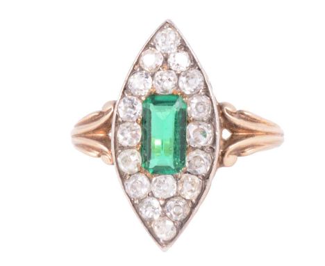 An emerald and diamond marquise cluster ring, the emerald cut emerald, approximately 7.6x4.6mm, surrounded by eighteen old cu
