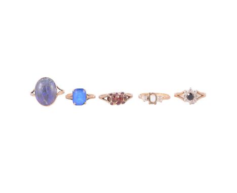 Five 9 carat gold gemset rings, a sapphire and synthetic white stone cluster ring, the brilliant cut sapphire surrounded by e
