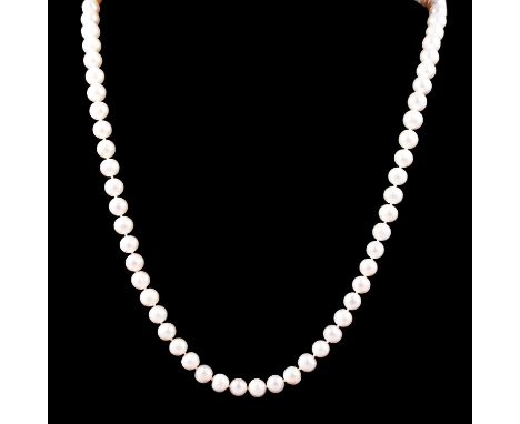 A rope of cultured freshwater pearls with circular jade rondel, eighty-six large off-round and two small off-round pearls kno
