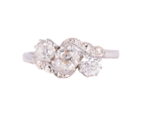A diamond three stone ring, the old brilliant cut stones claw set in an all white metal crossover mount ring size S, shank ma