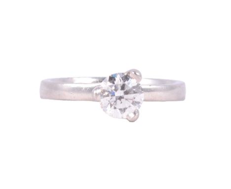 A diamond solitaire ring, the brilliant cut stone set with three claws on a platinum band ring size J/K, diameter of diamond 