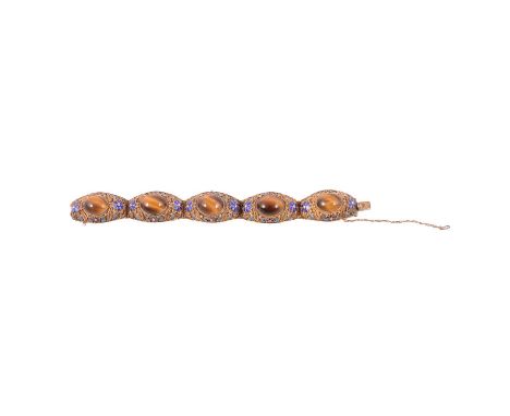 A gilt metal, tiger's eye and enamel bracelet, each of the five 21mm wide gilt metal filigree panels, marked Silver and testi