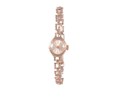 A lady's vintage 9 carat yellow gold manual wind bracelet wristwatch, 12mm circular champagne raised baton dial in a 14mm cir