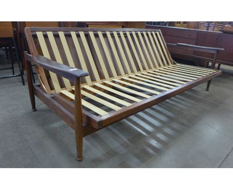 A Guy Rogers teak Manhattan sofa bed, designed by George Fejer and Eric Phamphilon