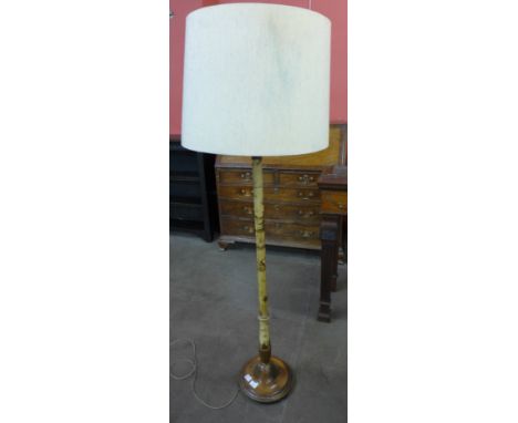 A cream Japanned standard lamp 