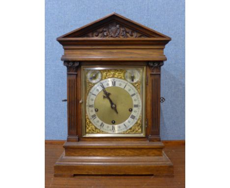 A 19th Century German Winterhalder &amp; Hofmeier carved oak bracket clock 