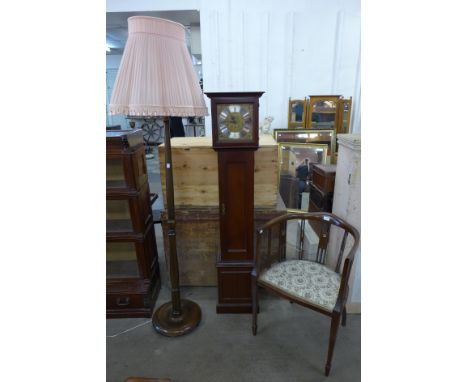 A mahogany dwarf longcase clock, a beech standard lamp and an Edward VII inlaid mahogany tub chair 