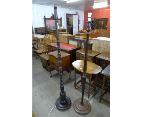 A carved oak standard lamp and a beech standard lamp 