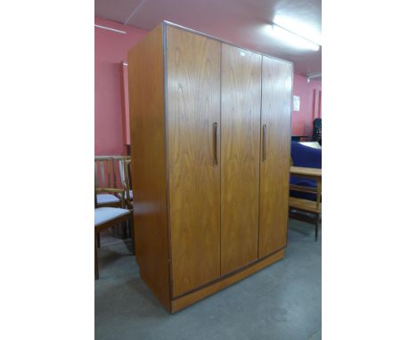 A G-Plan Fresco teak three door wardrobe 