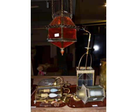 A middle Eastern style brass hanging lantern, a brass and coloured glass four-sided lantern, with three other light fittings