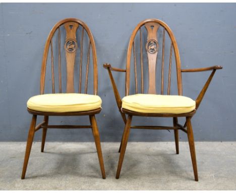 Set of six (4+2) Ercol swan back dining chairs 