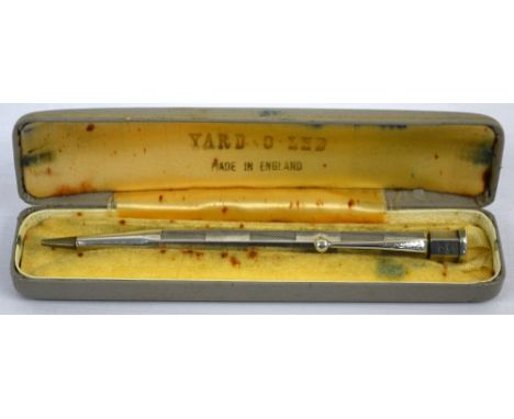 Silver pencil with engine turned boxed decoration, by Yard O Led, in original case, 11.5 cm long 