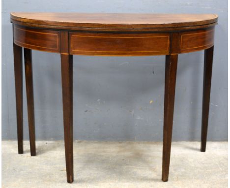 A 19th century mahogany demi lune folding card table.