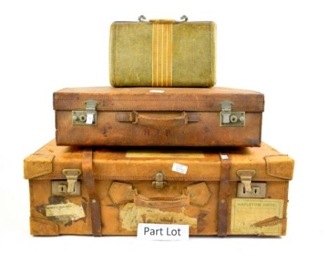 Large vintage leather suitcase with Canadian Pacific, Union Castle Line and other travel stickers, a smaller leather suitcase