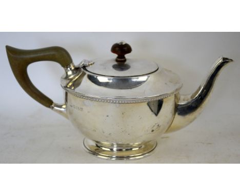 George V silver bachelor teapot, the squat circular body on stepped foot and with angular handle, by A E Jones, Birmingham 19