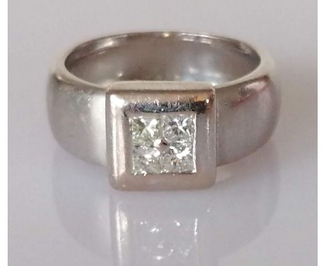 A diamond ring, set with four princess-cut diamonds, weighing an estimated total of 0.40 carats, colour and clarity: three st