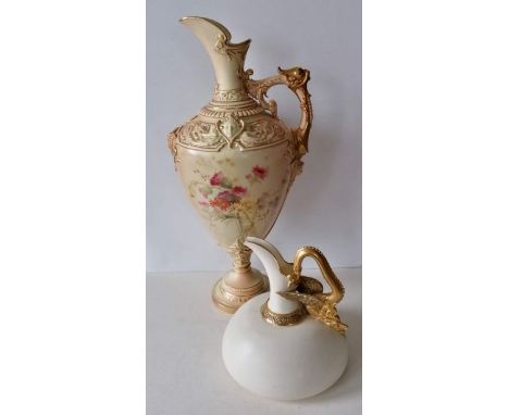 A large Royal Worcester blush ivory ewer, the frieze decorated with cherubs and grotesque masks, the body enamel decorated wi