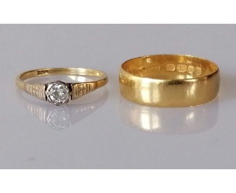 A solitaire diamond ring on a yellow and white gold setting, the diamond approximately 0.20 carats, size Q, stamped 18ct, 2.4