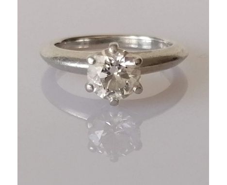 A Tiffany &amp; Co. solitaire diamond ring in a six-claw platinum setting, the round brilliant-cut diamond certified 1.04 car