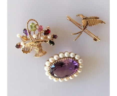 A multi-gem set gold brooch in the form of a basket, 30 x 35mm; a kingfisher gold brooch with ruby decoration, 30 x 30mm, bot