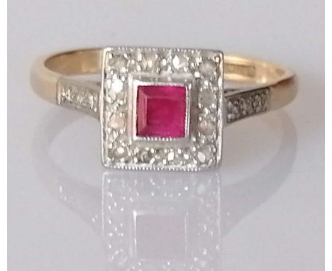 An Art Deco ruby and diamond ring a yellow gold and platinum setting, the square-cut ruby approximately 0.20 carats, surround